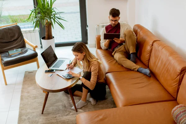 Pretty Young Woman Using Laptop Young Man Using Digital Tablet — Stock Fotó