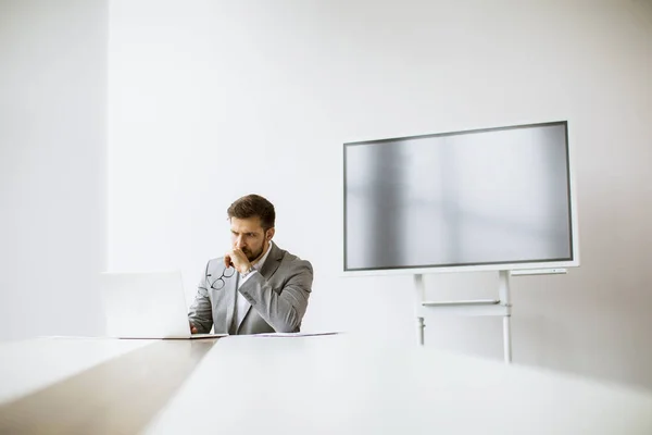 Handsome Young Man Working Laptop Bright Office Big Screen Him — Stock Photo, Image