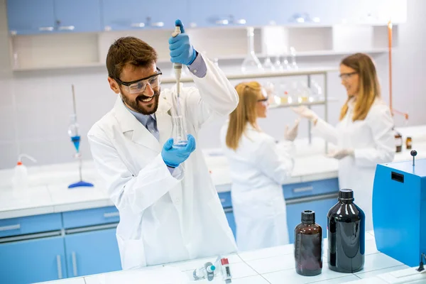 Handsome Young Researcher Protective Workwear Standing Laboratory Analyzing Flask Liquid — Stock Photo, Image