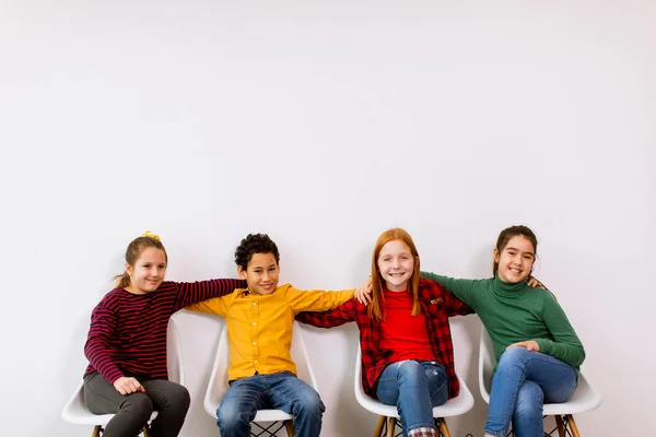 Portrait Cute Little Kids Jeans Sitting Chairs White Wall — Stock Photo, Image