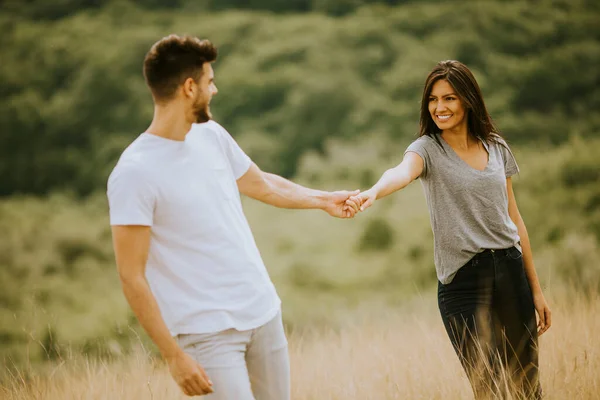 Happy Young Couple Love Walking Grass Field Summer Day — Stok Foto