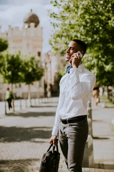 Handsome Young African American Businessman Using Mobile Phone While Waitng — Stock Photo, Image