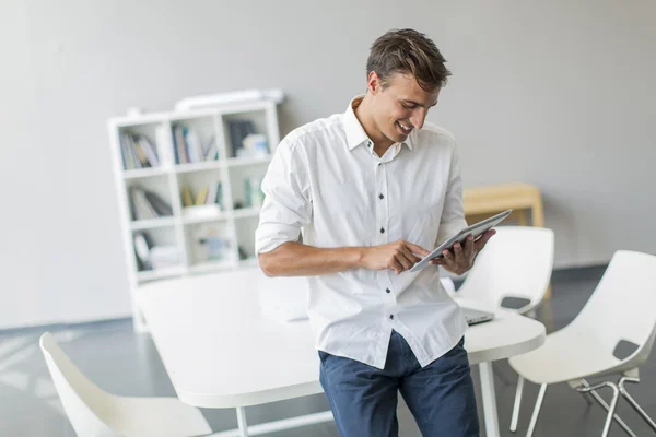 Man with tablet in office — Stock Photo, Image