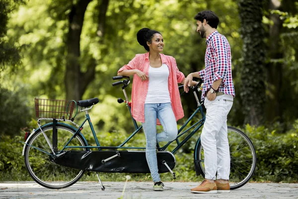 Couple riding on bicycle — Stock Photo, Image