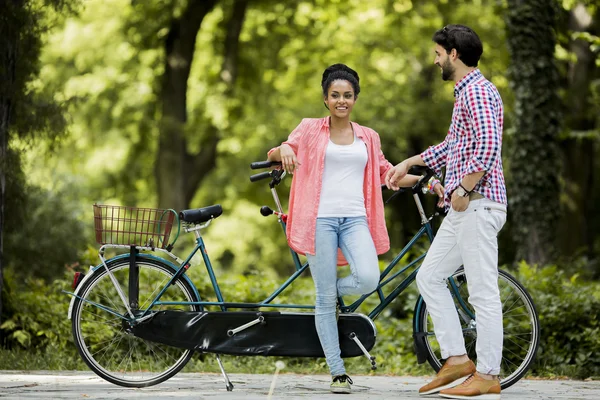 Couple riding on bicycle — Stock Photo, Image