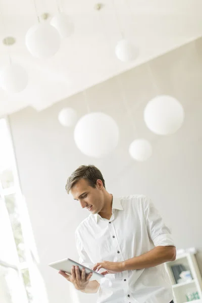 Man with tablet in office — Stock Photo, Image