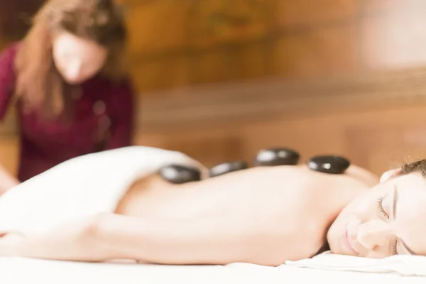 Hot stone massage therapy — Stock Photo, Image