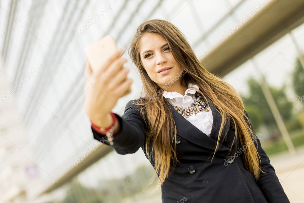 Young woman taking a selfi with mobile phone