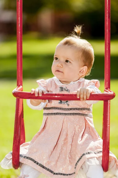 Little girl at the swing — Stock Photo, Image