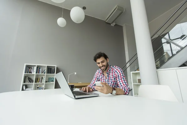 Young man in the office — Stock Photo, Image