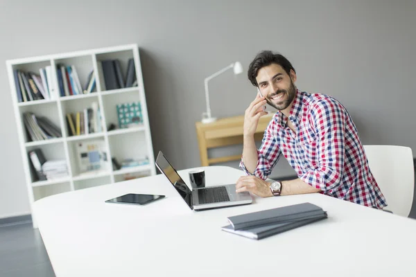 Young man in the office — Stock Photo, Image