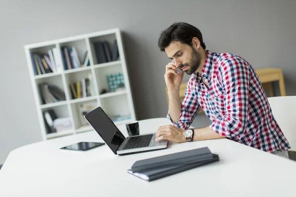 Young man in the office — Stock Photo, Image