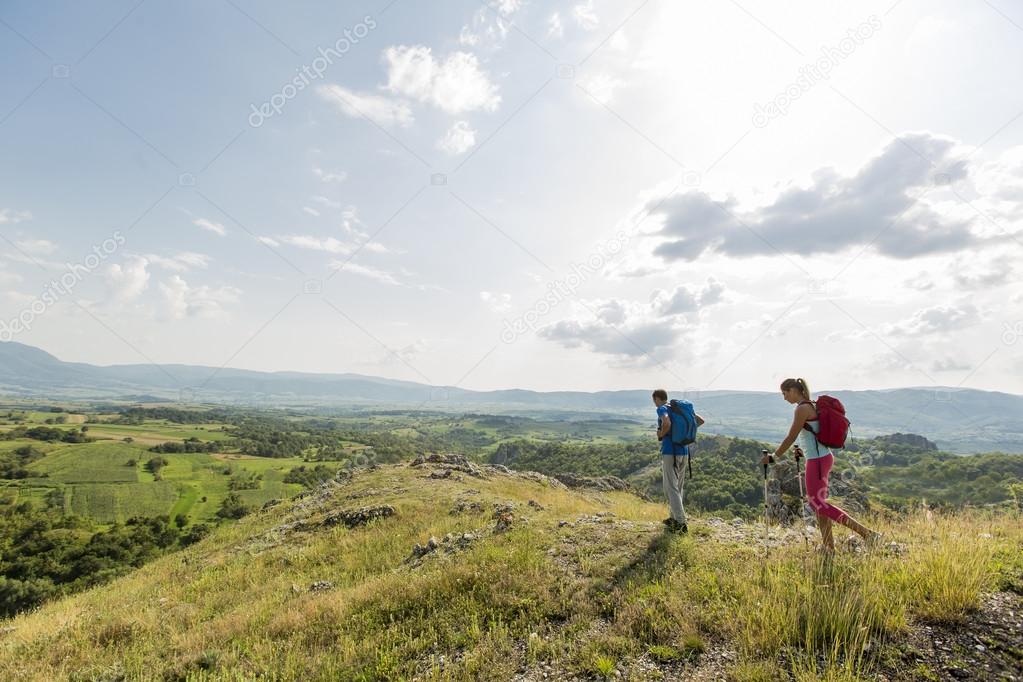 Young couple hiking on the mountain