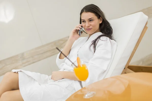 Young woman by the pool — Stock Photo, Image