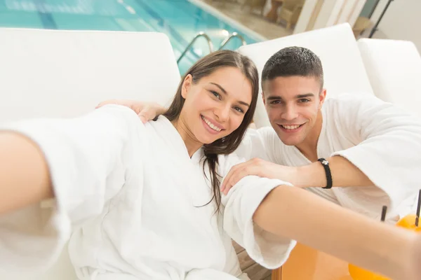 Young couple by the pool — Stock Photo, Image