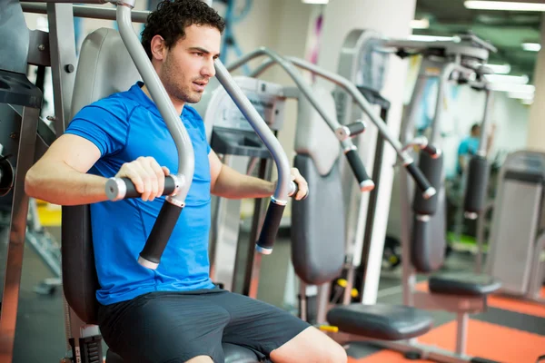 Young man in the gym — Stock Photo, Image