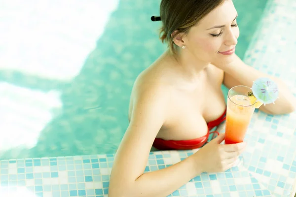 Young woman in the swimming pool — Stock Photo, Image
