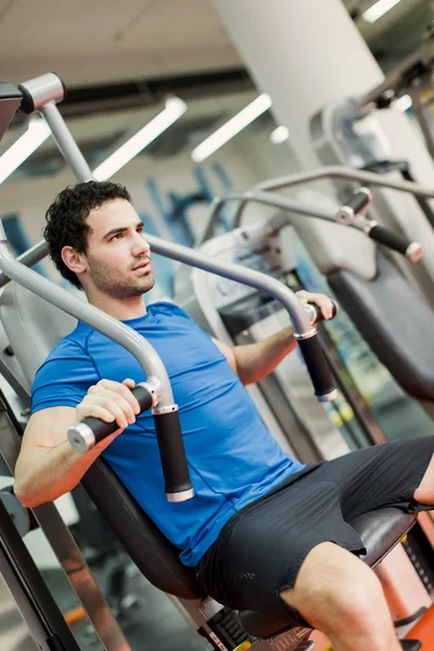 Young man in the gym — Stock Photo, Image