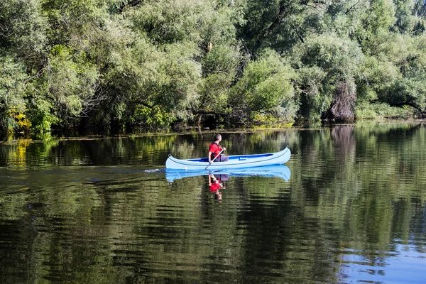 Young man in canoe — Stock Photo, Image