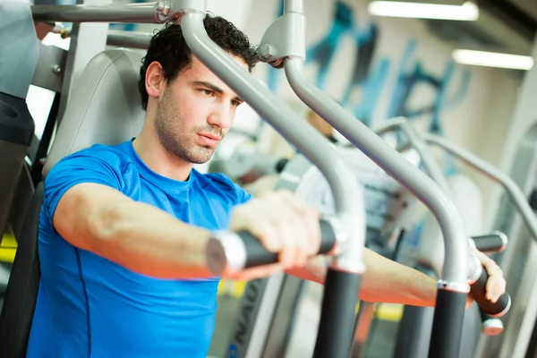 Young man in the gym — Stock Photo, Image