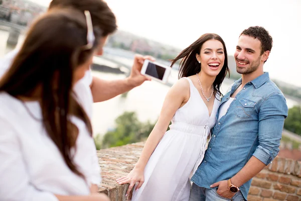 Young people on the waterfront — Stock Photo, Image