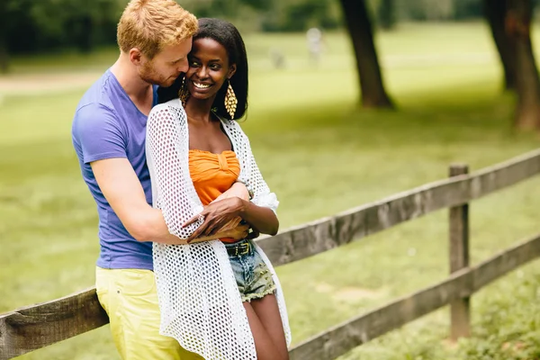 Multiracial couple in the park — Stock Photo, Image