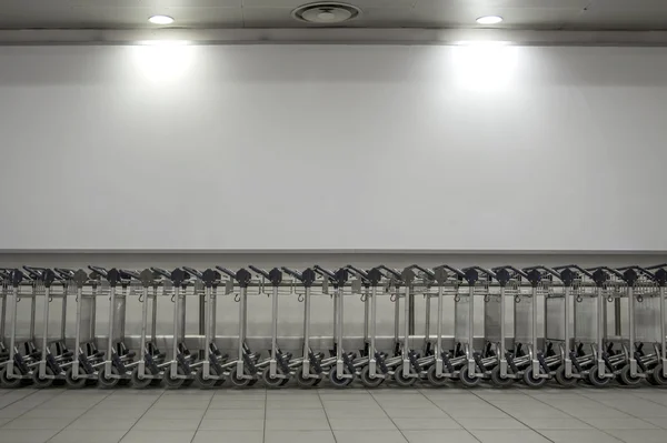 Metal trolleys in a store — Stock Photo, Image