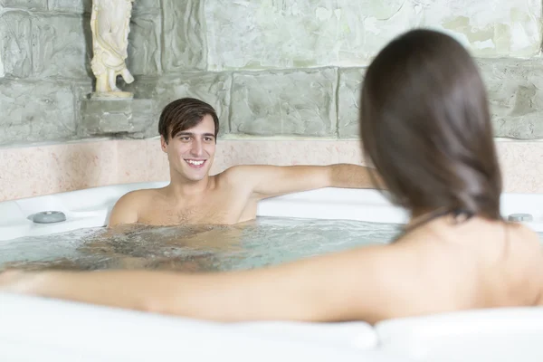 Couple relaxing in the hot tub — Stock Photo, Image
