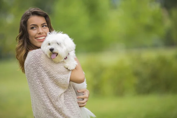 Woman with a maltese dog — Stock Photo, Image