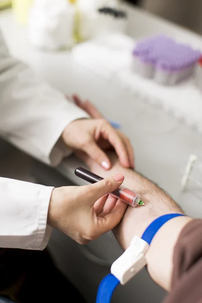 Taking blood in laboratory — Stock Photo, Image