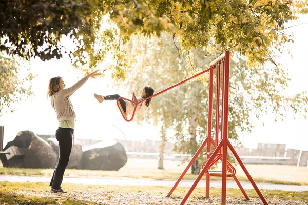 Little girl with mother — Stock Photo, Image