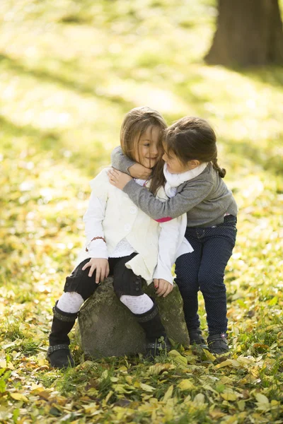 Girls at the autumn park — Stock Photo, Image