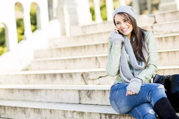 Woman sitting on the stairs — Stock Photo, Image