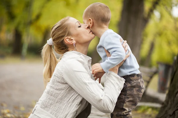 Mother and son in the forest Stock Image