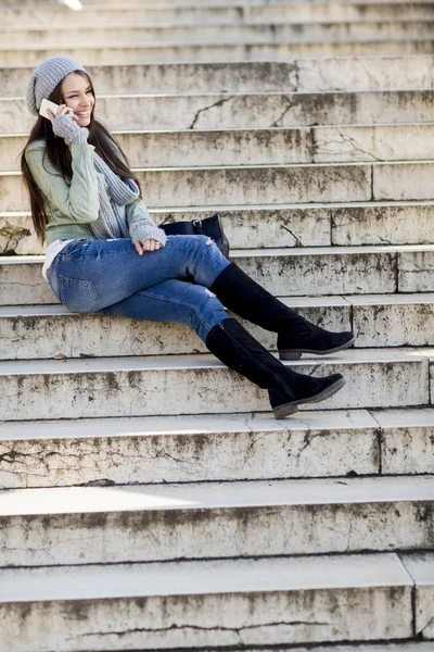 Woman sitting on the stairs — Stock Photo, Image