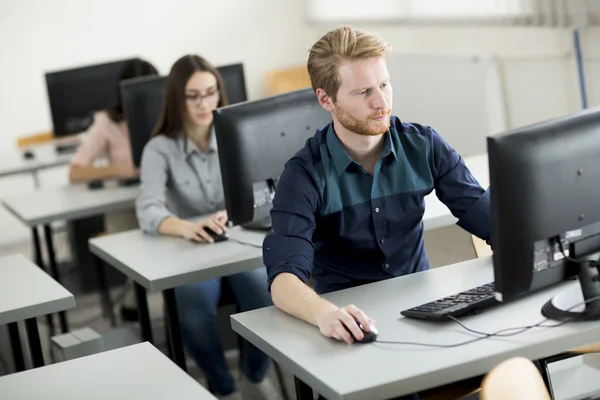 Young people in the classroom — Stock Photo, Image