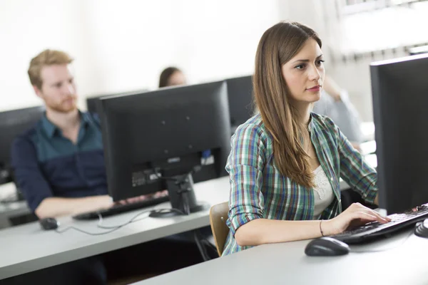 Young people in the classroom — Stock Photo, Image