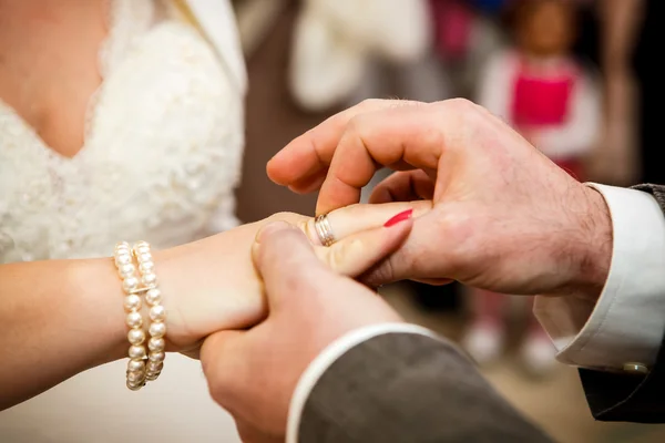 Couple putting wedding rings — Stock Photo, Image