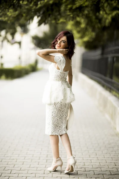 Young woman in white drress — Stock Photo, Image