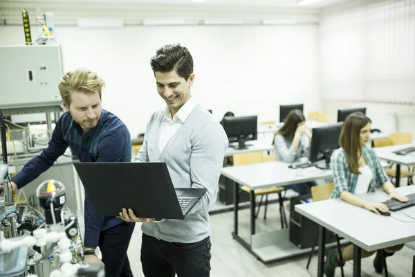 Young people in the classroom — Stock Photo, Image