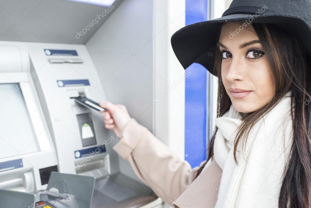 Woman using the ATM