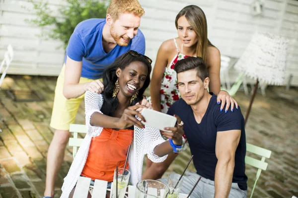 Multiracial friends at cafe — Stock Photo, Image