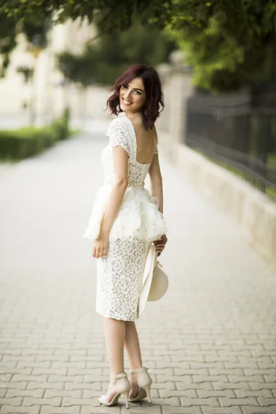 Young woman in white drress — Stock Photo, Image