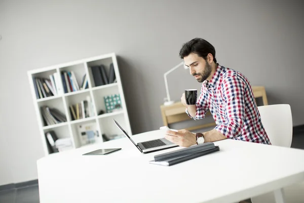 Young man in the office — Stock Photo, Image