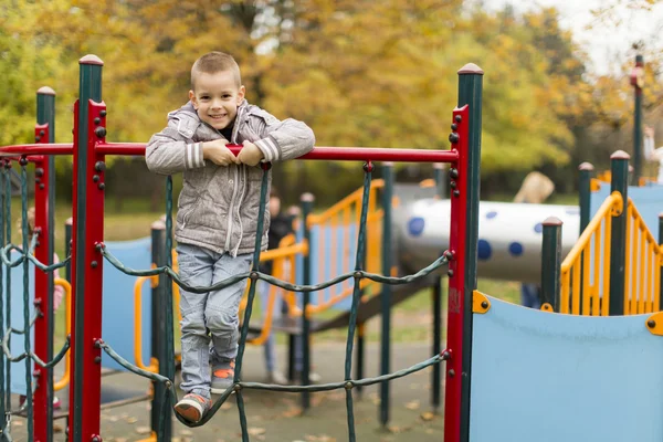 Little boy at playground Stock Image