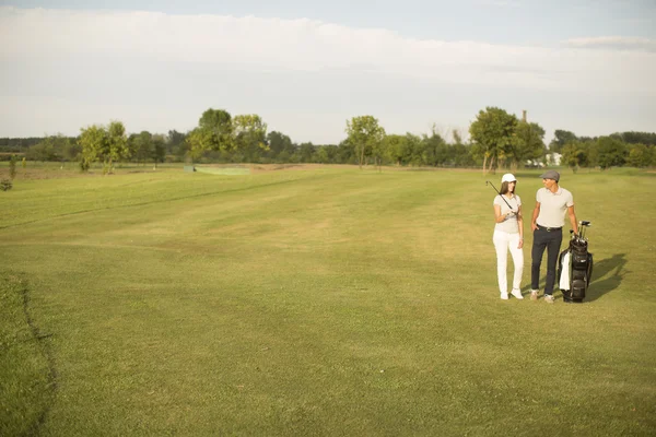 Para na pole golfowe — Zdjęcie stockowe