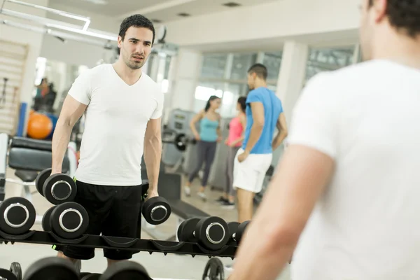 Young man in the gym — Stock Photo, Image