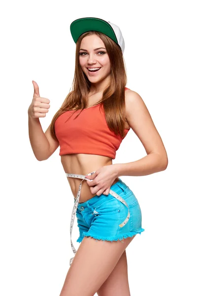Excited teen girl measuring her waist — Stock Photo, Image
