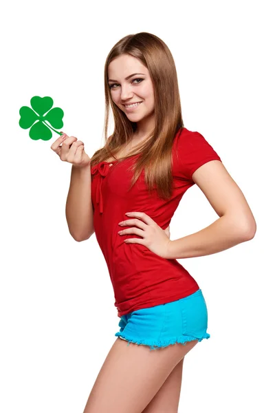 Happy teenager holding shamrock leaf — Stock Photo, Image