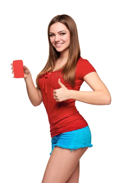 Smiling teen girl holding blank credit card — Stock Photo, Image